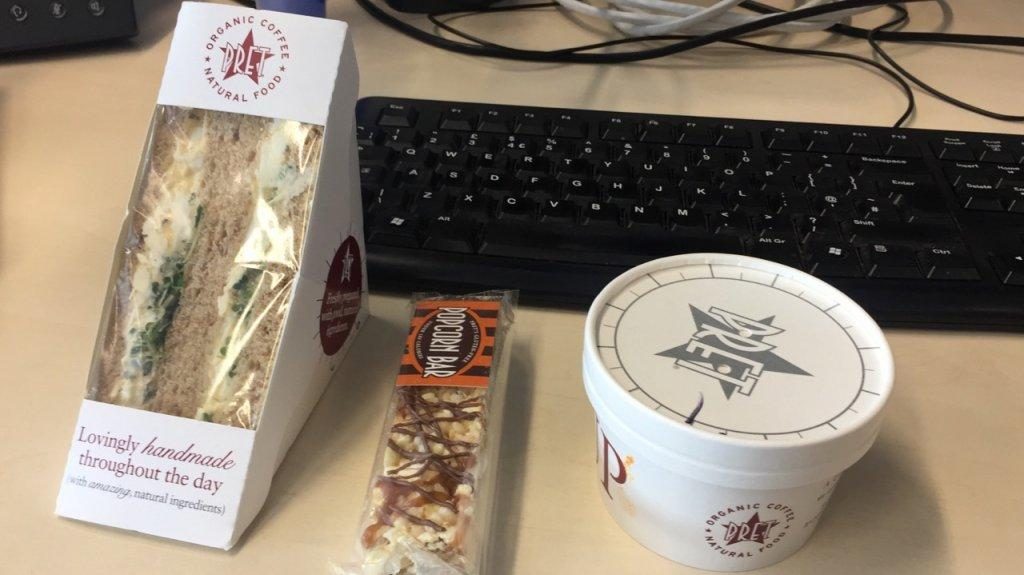 Different Types Of Junk Food Next To A Black Keyboard
