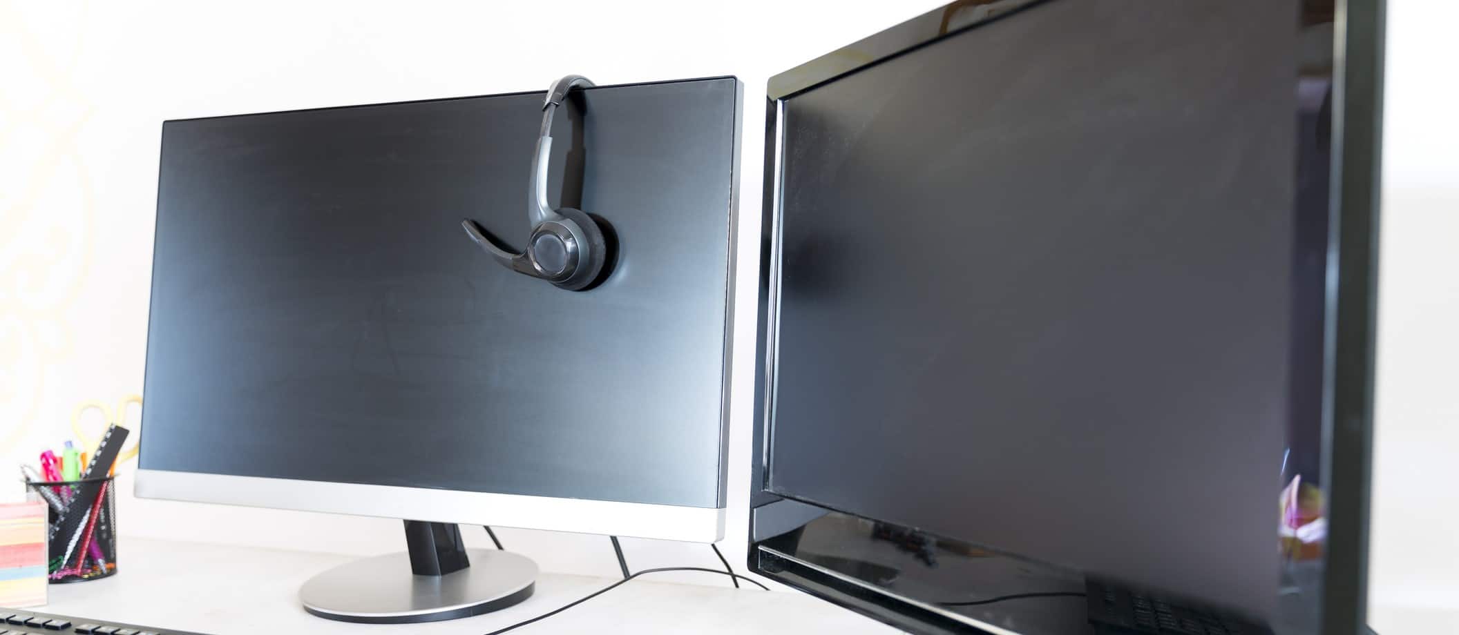 two monitors and a headset