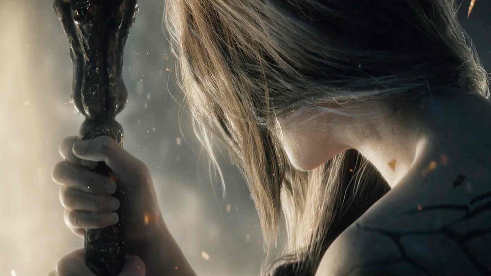 white-haired woman clutching on to staff