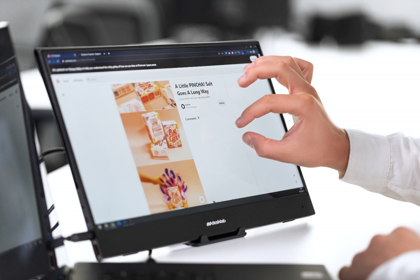 A picture containing text, electronics, person, indoor Description automatically generated