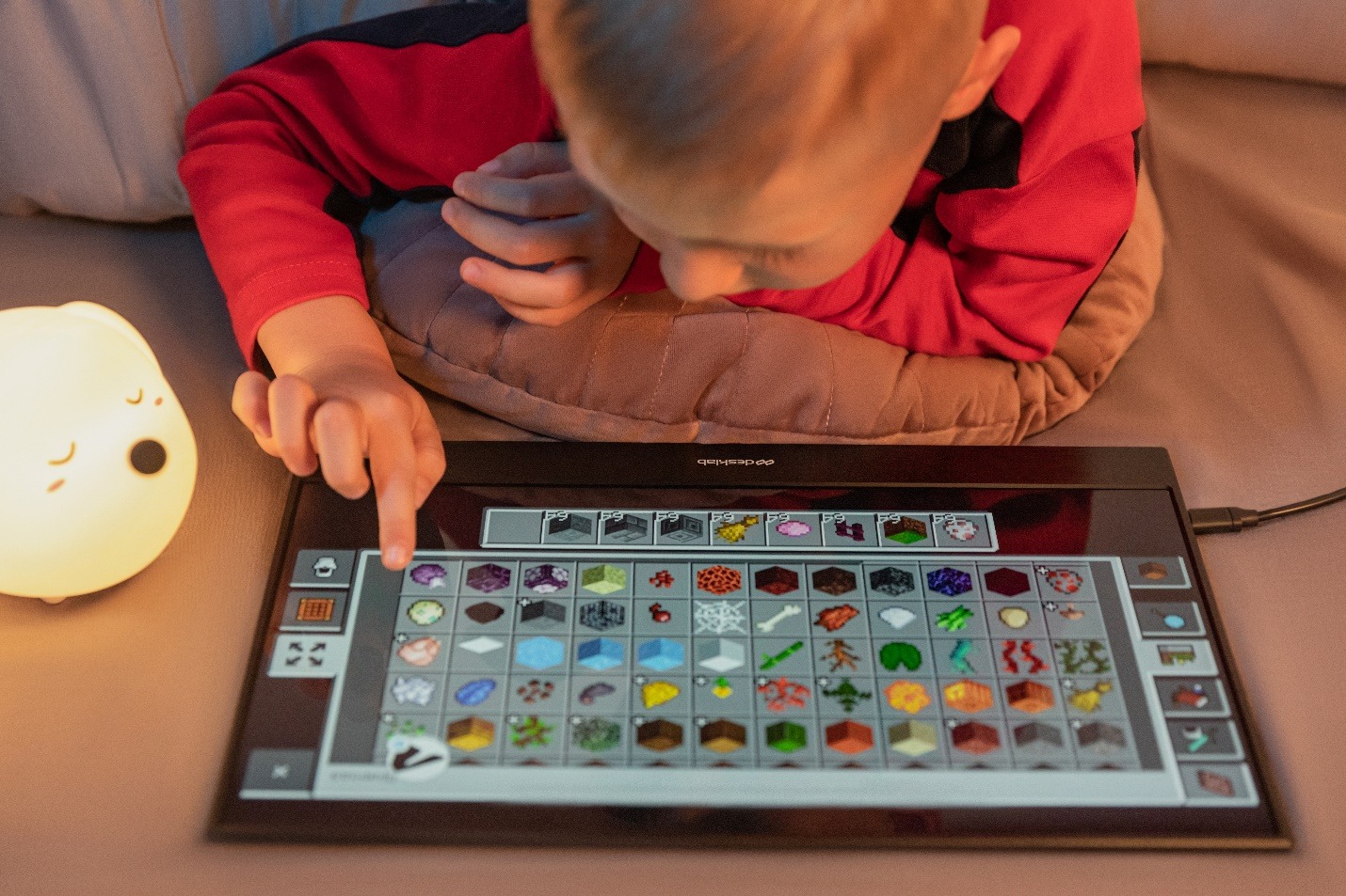 A picture containing text, person, indoor, child Description automatically generated